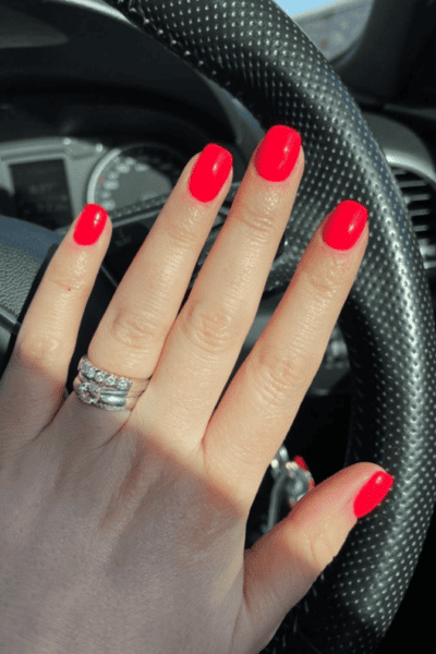 bright coral is one of the best nail colors for fair skin 