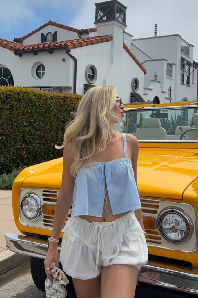 19 Chicest Beach Outfits That Belong in Your Summer Photo Dump baby blue tie-front cami & white cargo short