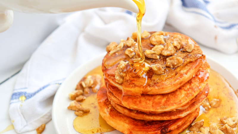 Pumpkin Pancakes With Thick Fluffy Stacks and Maple Syrup Running Everywhere